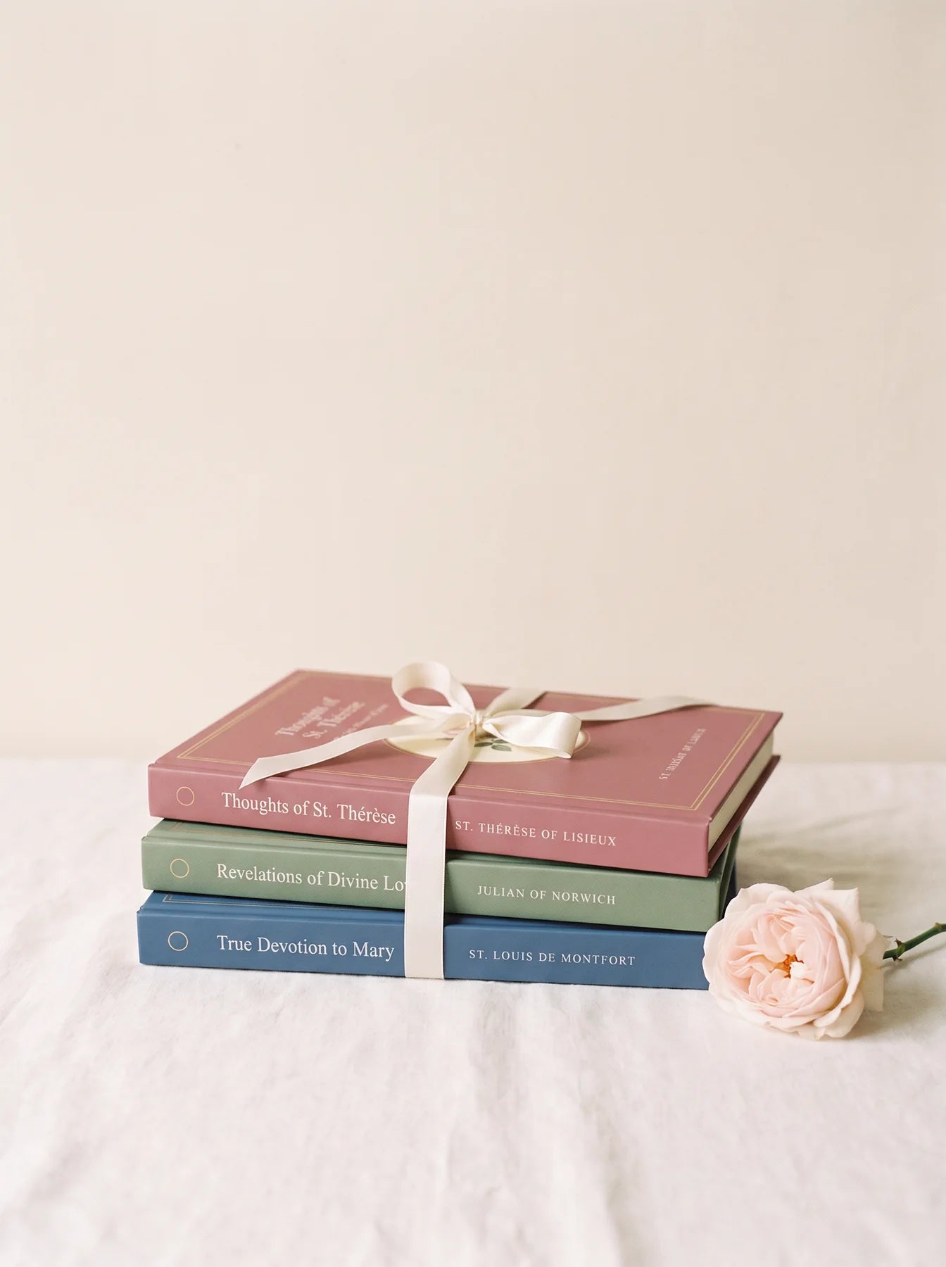 The three Ploughman Press books tied with a ribbon